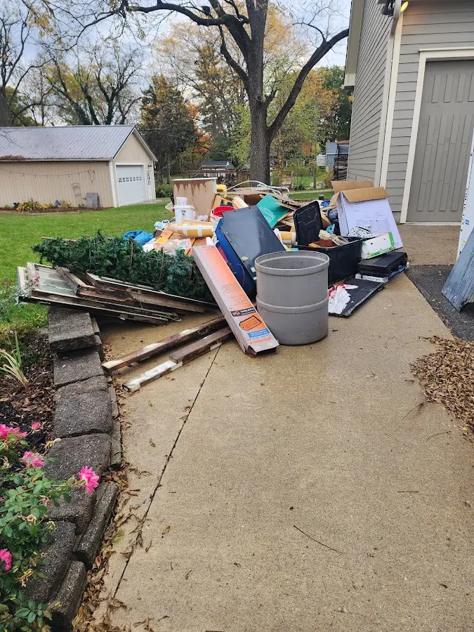 Dumpster being loaded with debris for Estate Cleanout Dumpster Rental in Aberdeen